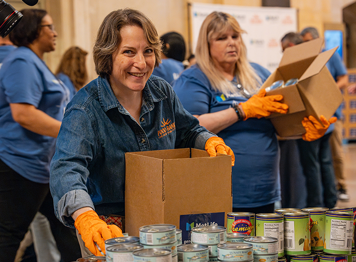 A women organizing cans into a box. Links to Gifts from Retirement Plans retirement.jpg