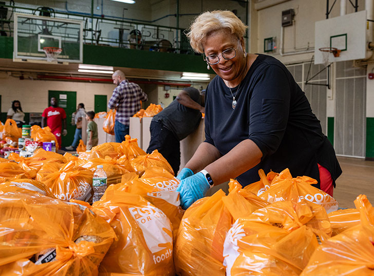 A volunteer organizing bags of food. Links to Donor-Advised Funds daf.jpg
