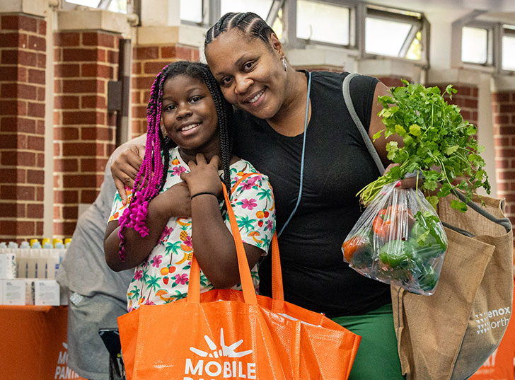 A mother and daughter smiling. Links to Closely Held Business Stock stock.jpg