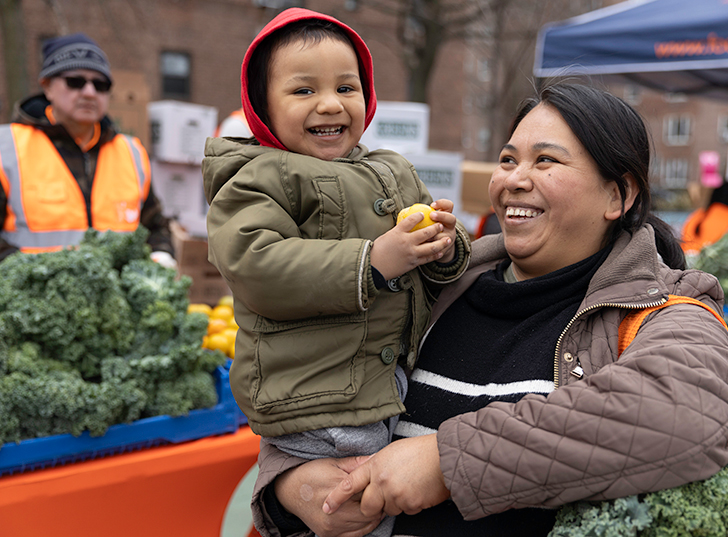 A mother holding her smiling child. Links to Gifts That Protect Your Assets assets.jpg
